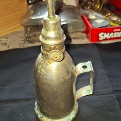 Antique French Lampe-Briquet lighter lamp manufactured by the brand TH. It is described as Sans Soudure The inscription Inexplosible indicates it was marketed as a safety product, often dating from before 1900s