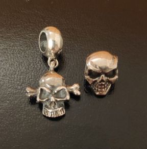 2 silver tone charms skull & skull bones
