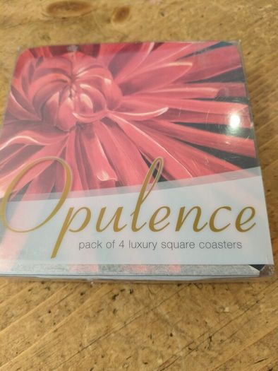 set of four Opulence brand square coasters featuring a vibrant red dahlia flower design. New in Package.