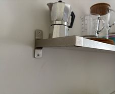 Wall shelf with brackets