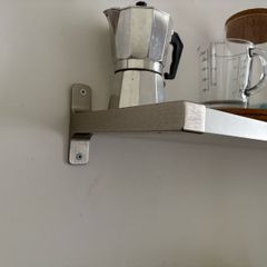 Wall shelf with brackets