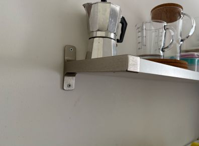 Wall shelf with brackets