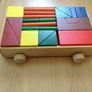 Colourful Wooden shapes construction game in wooden trolley Image 2