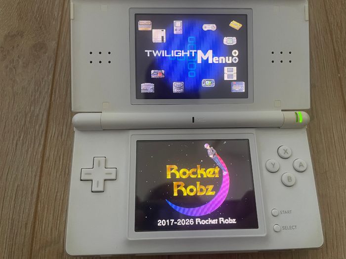 Modded Nintendo DS Lite crystal white USG 001 boxed with manual with Flash Card 32gb with Games and retro games (Neo Geo, Nes, Gameboy Color, Atari.