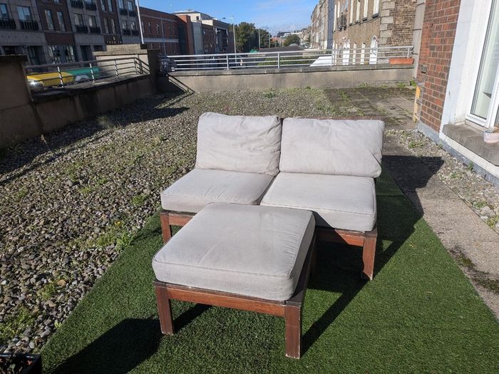 Wooden outdoor lounger with cushions