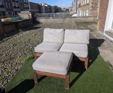 Wooden outdoor lounger with cushions
