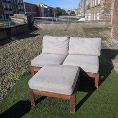 Wooden outdoor lounger with cushions