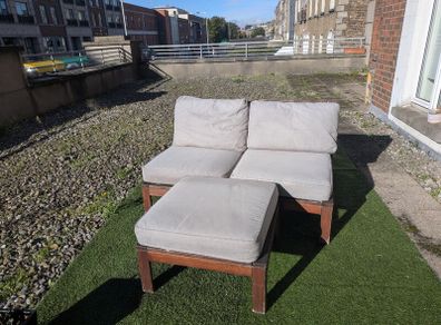 Wooden outdoor lounger with cushions