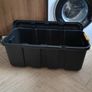 Black plastic storage trunk with lid on wheels Image 2