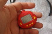 vintage  dinkie dino red tamagotchi
