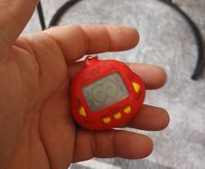 vintage  dinkie dino red tamagotchi