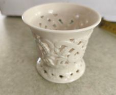 Vintage porcelain tealight holder. Bright white. Filigree. Cut out. Candle. Regal. Circa late 20th century.