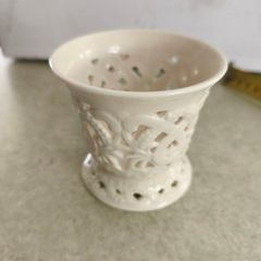 Vintage porcelain tealight holder. Bright white. Filigree. Cut out. Candle. Regal. Circa late 20th century.