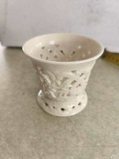 Vintage porcelain tealight holder. Bright white. Filigree. Cut out. Candle. Regal. Circa late 20th century.