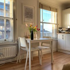 white extendable table and 4 chairs