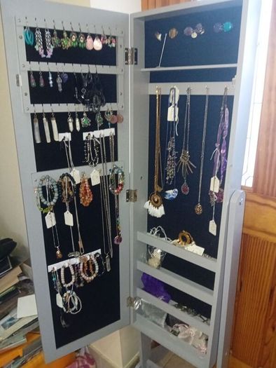 Grey freestanding jewellery cabinet with mirror