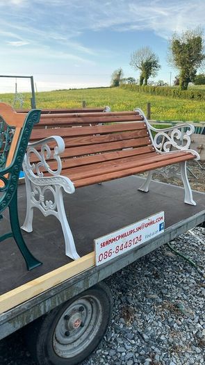 Raised beds bird feeders and cast iron benches