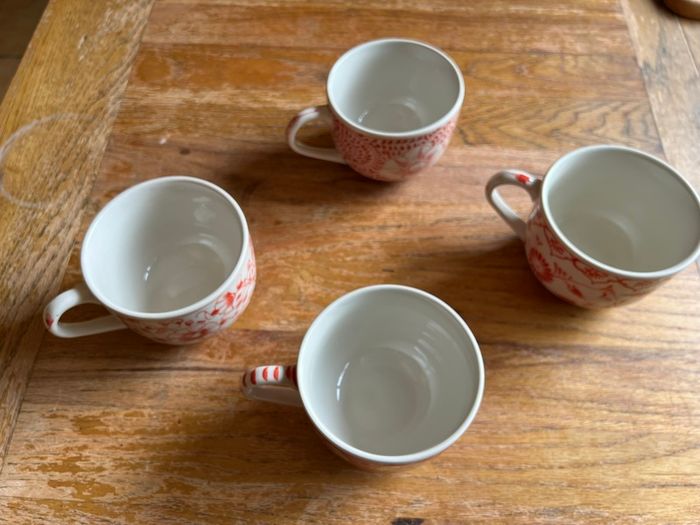 Four decorative cups