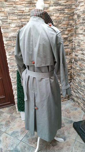 Vintage Nuage ladies trenchcoat Approximately late 90s early 00s Size 10 on label The colour is a pale bluey grey with brown buttons It's got an inner lining that can be removed