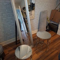 two glass tadles and large mirror