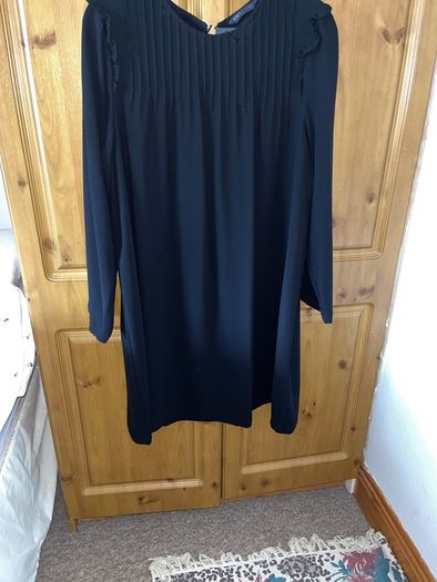 Dress M&S, black, long sleeves, very dressy, round neck with pleated detail at top.