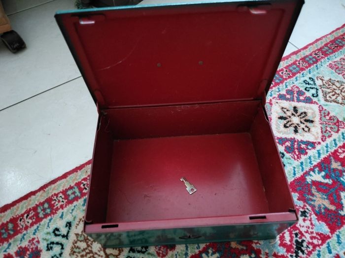 Vintage green metal cash box with key
