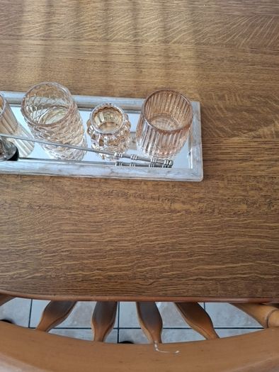 Candle holder display with candle extinguisher