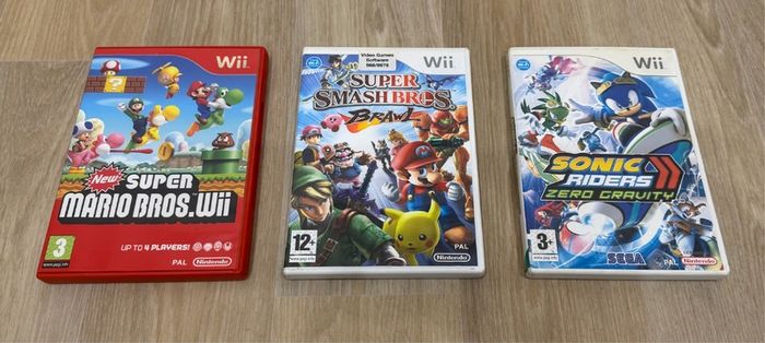 Wii games bundle - Mario bros Wii, Smash Bros Brawl, and Sonic Riders