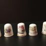 Collection of Flower Themed Gold Coloured Edged Thimbles Image 2