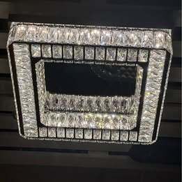 Crystal Chandelier with stainless steel and mirrored finish. 3 colour options. Remote Control.