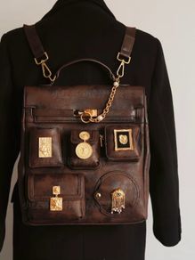 Vintage inspired dark brown backpack with antique gold details