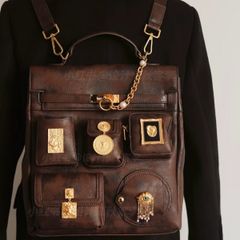 Vintage inspired dark brown backpack with antique gold details