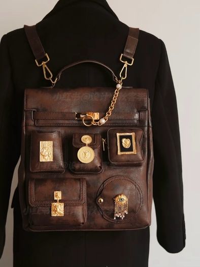Vintage inspired dark brown backpack with antique gold details