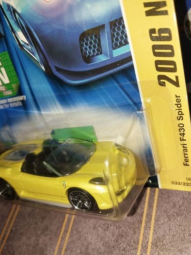 Hot Wheels Ferrari die-cast model cars from the mid-2000s and late 1990s card collections.