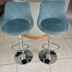 Pair of teal velvet bar stools