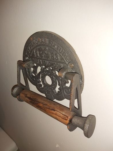Cast iron toilet holder