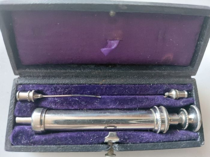 Antique medical syringe in original box