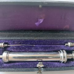 Antique medical syringe in original box