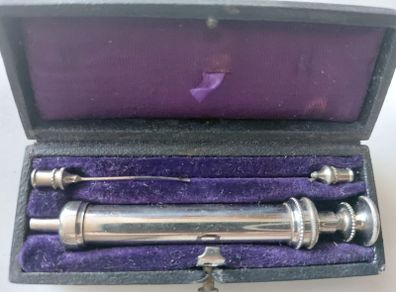 Antique medical syringe in original box