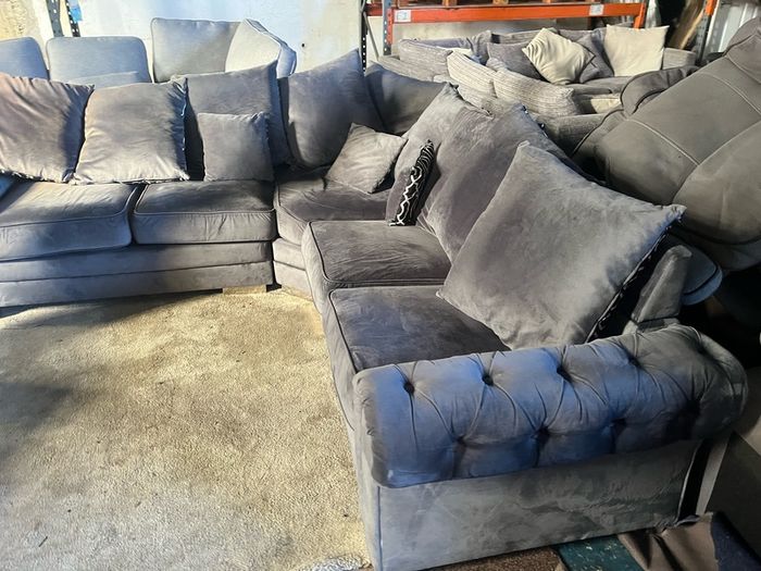 Grey corner sofa with scatter cushions