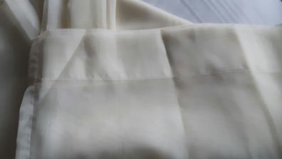 Cream/ivory voille curtains.