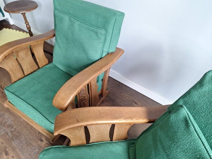 Pair of green arm chairs.