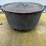Antique cast iron tri-legged dutch oven and lid. Image 2
