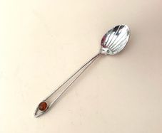 Antique coffee spoon with amber