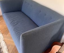 Blue two-seater sofa - button back detail