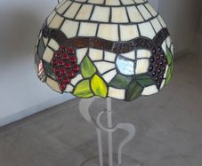Tiffany style lamp with stained glass shade.