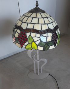 Tiffany style lamp with stained glass shade.