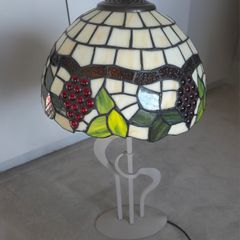 Tiffany style lamp with stained glass shade.
