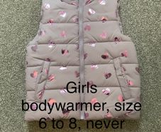 Girls body warmer, size 6 to 8, never worn