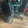Glass dining table with rotator and 4 leather chairs Image 3